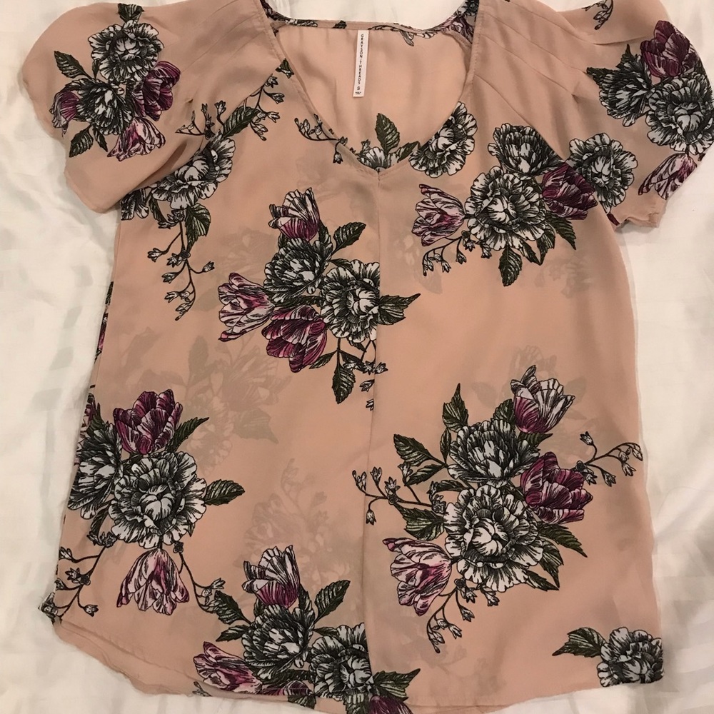 Pink blouse with flowers.